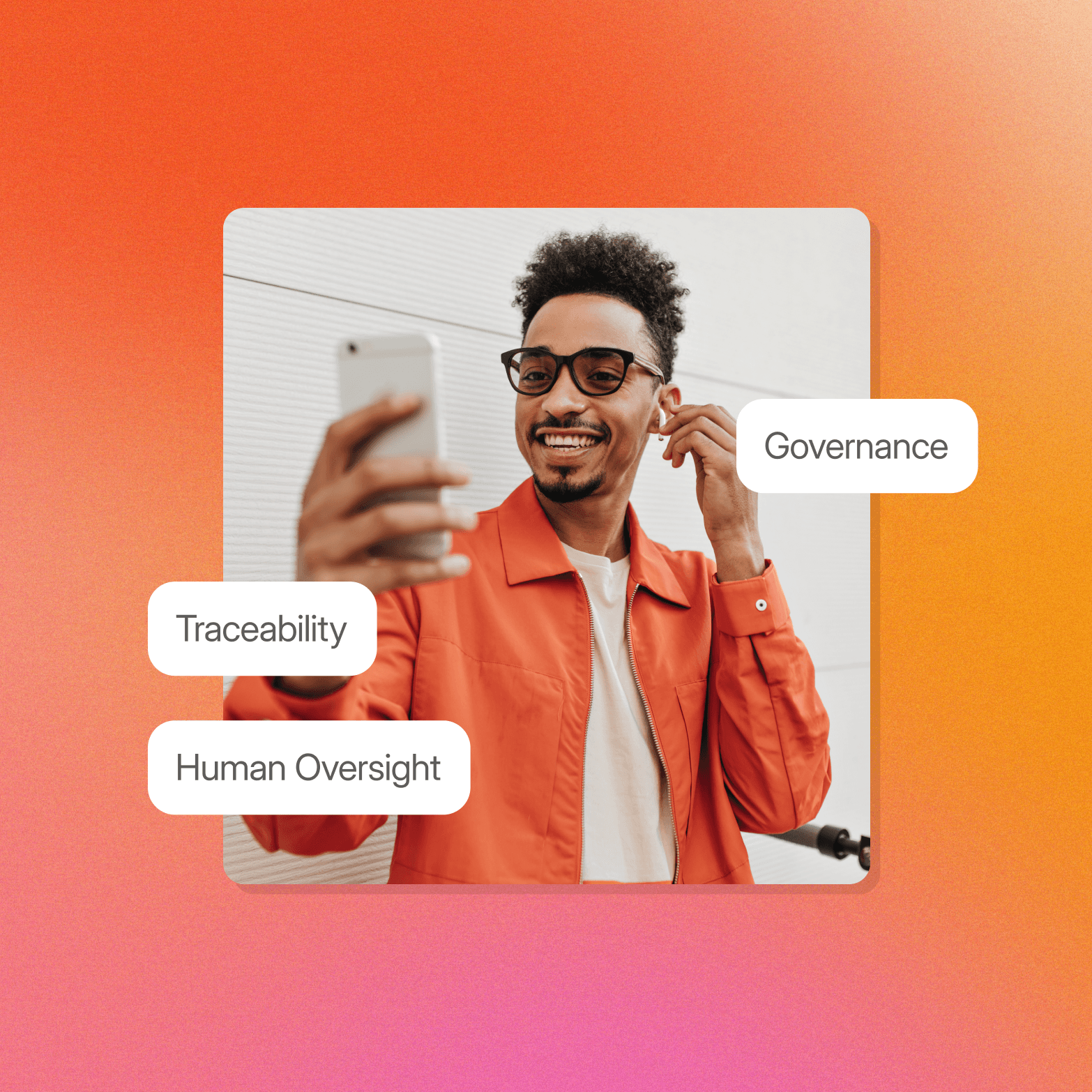 "Man in an orange jacket taking a selfie while adjusting an earbud, with three floating labels reading Governance, Traceability, and Human Oversight"