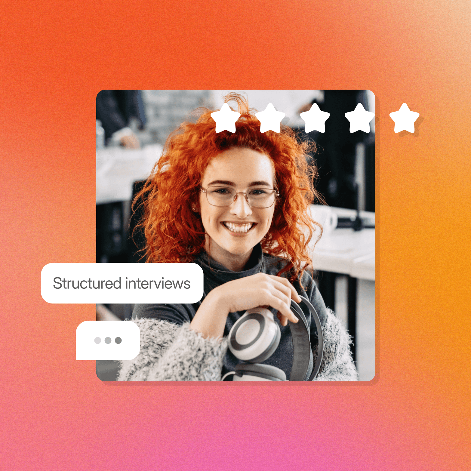A smiling woman with curly red hair and glasses holds a pair of headphones in an office setting, with five white star icons overlaid above her head and two white speech bubble icons to her lower left, one labeled "Structured interviews" and one showing an ellipsis, all set against a warm orange-to-pink gradient background.