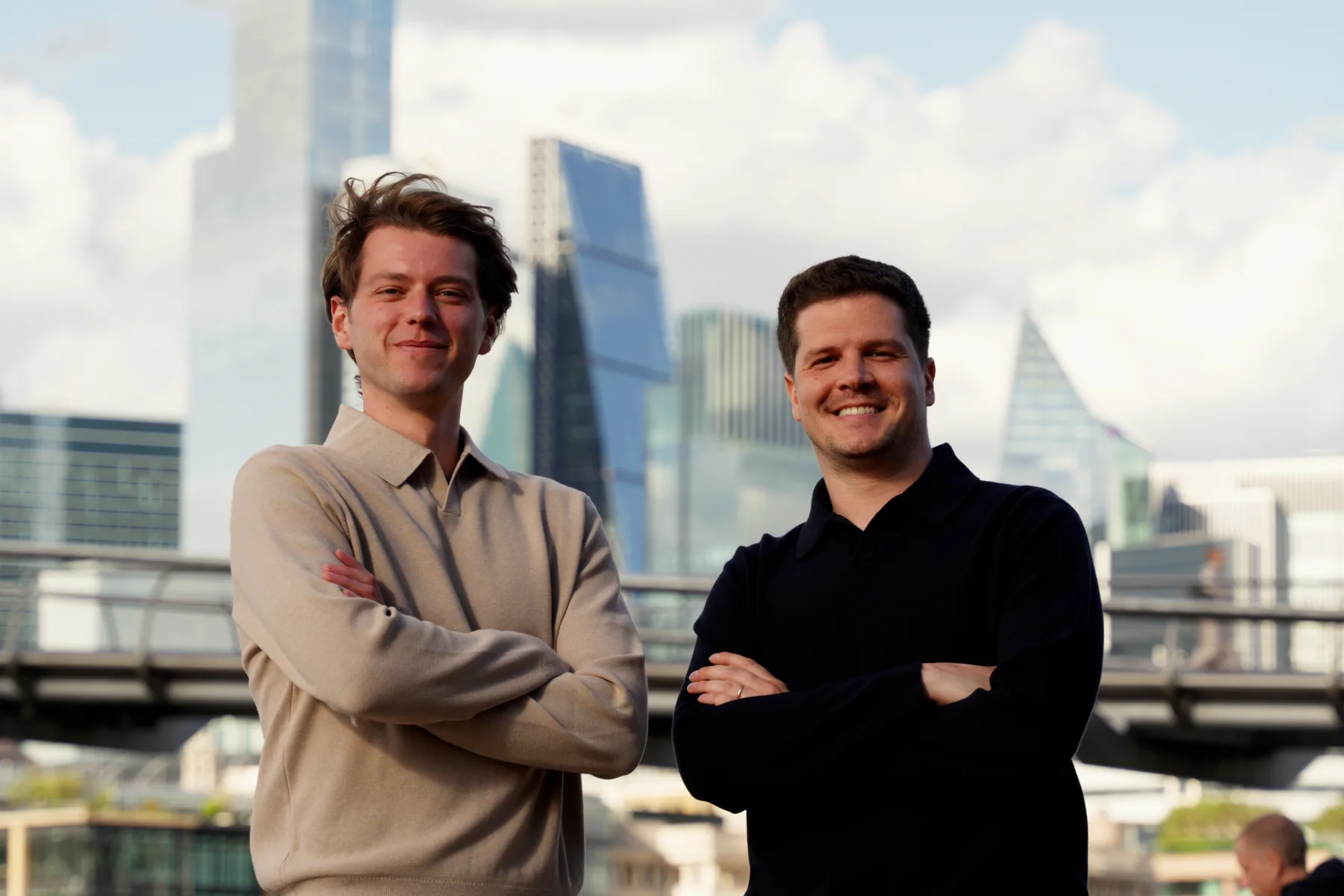 Hendrik Van Hove and Dieter De Mesmaeker on the Thames, with the City of London behind them