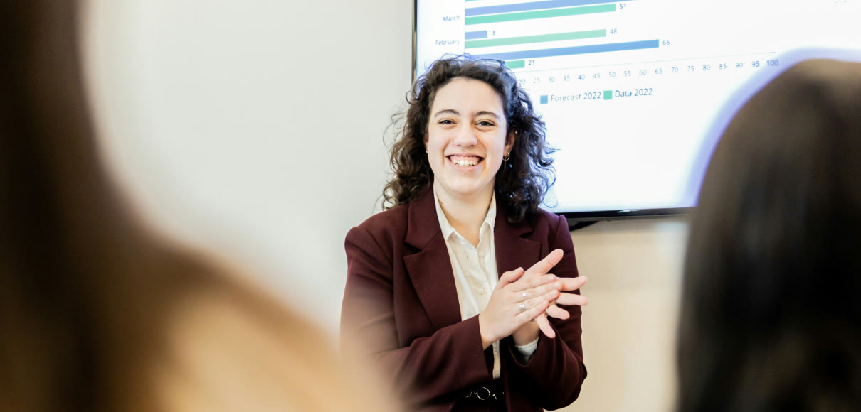 An insights lead presenting research results to colleagues