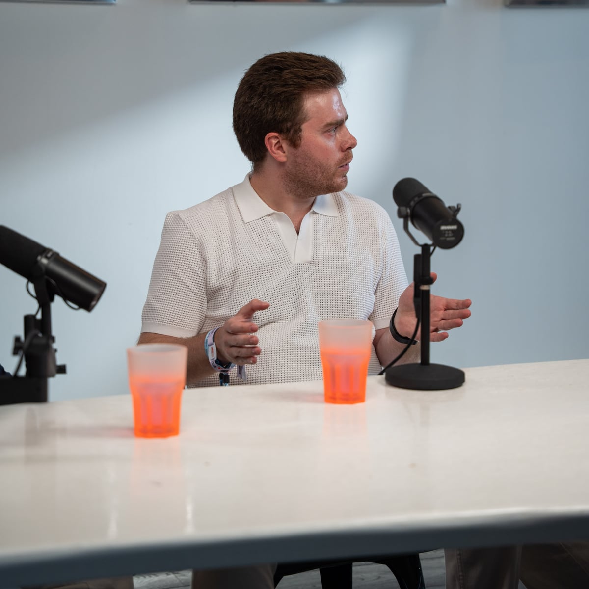 Doug Tallmadge of Gradial in a white polo gesturing as he talks on the Conveo podcast set at Cannes Lions 2026
