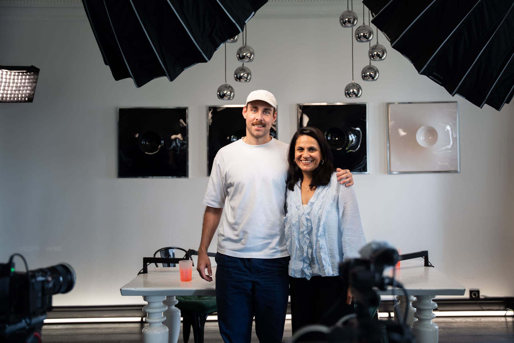 Lulu Raghavan and Conveo host Tom Husson pose together on the podcast set after recording at Cannes Lions 2026.
