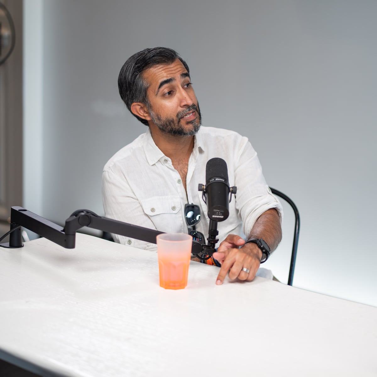Ravi Rabheru smiling at the microphone on the Conveo podcast set at Cannes Lions 2026