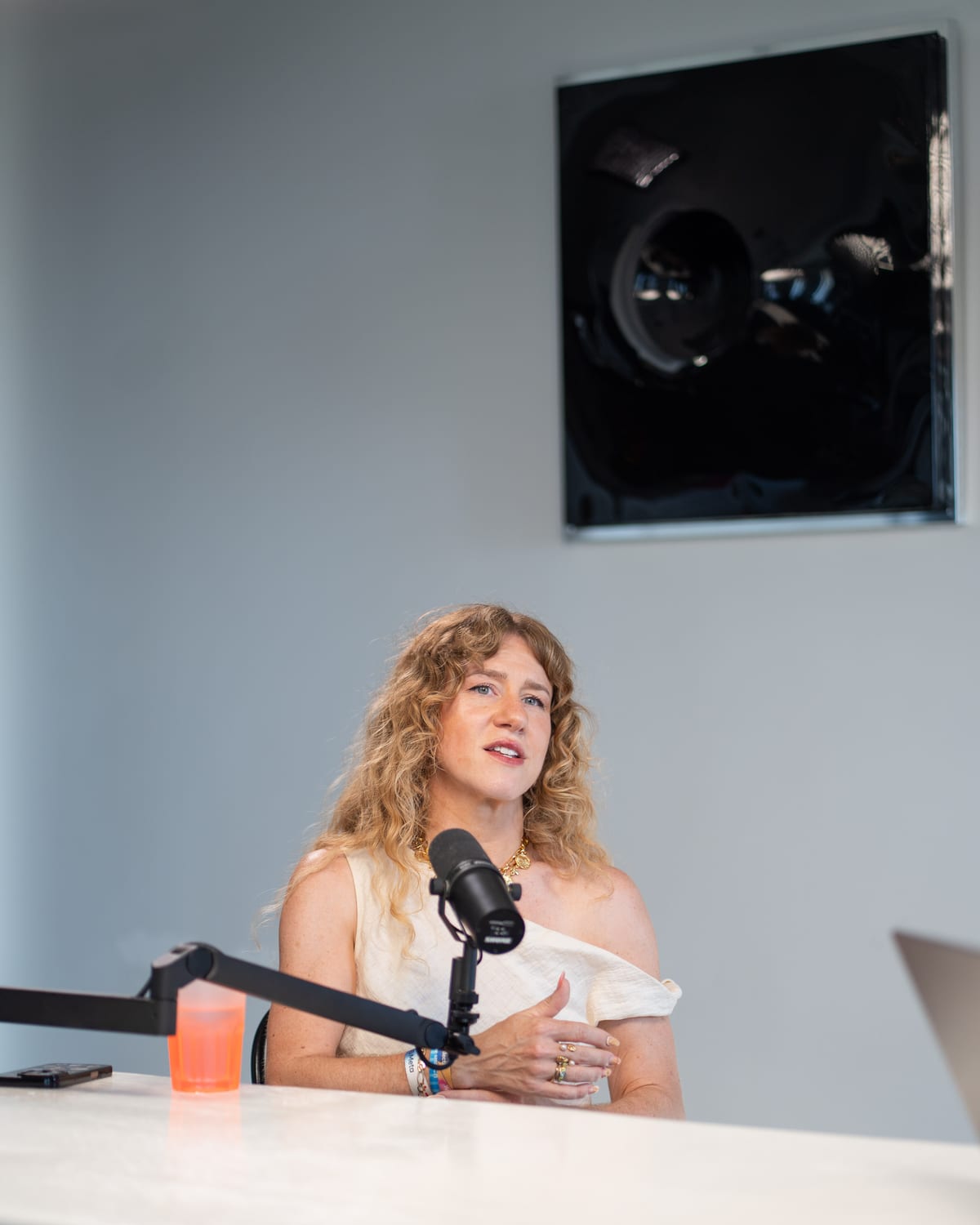 Close portrait of Meredith Smith speaking into a microphone on the Conveo podcast set at Cannes Lions 2026