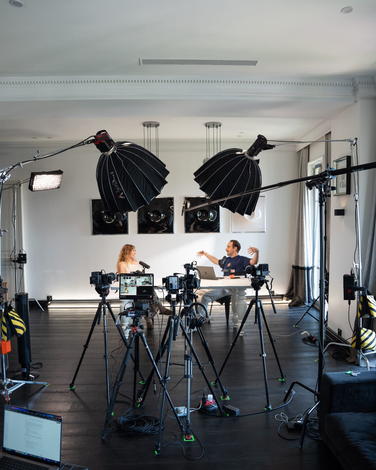 Wide shot of the Conveo podcast studio with softbox lights, camera rigs and the recording table at Cannes Lions 2026