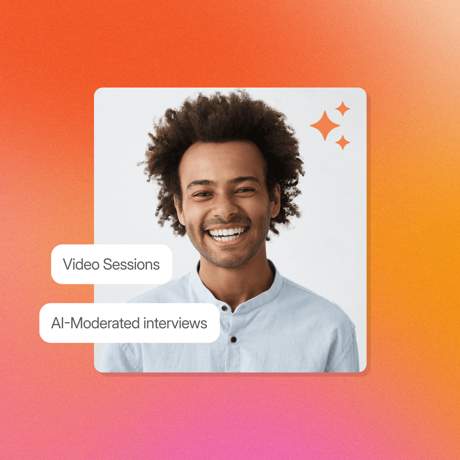 A smiling man in a light blue shirt against a grey background, with two white pill-shaped labels overlaid to his left: "Video Sessions" and "AI-Moderated interviews." An orange sparkle icon appears in the upper right corner of the photo, all set against a warm orange-to-pink gradient background.
